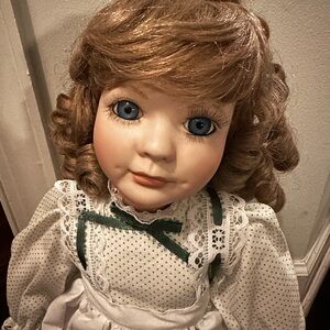 Vintage Porcelain Doll with Blue Eyes and Lace Dress